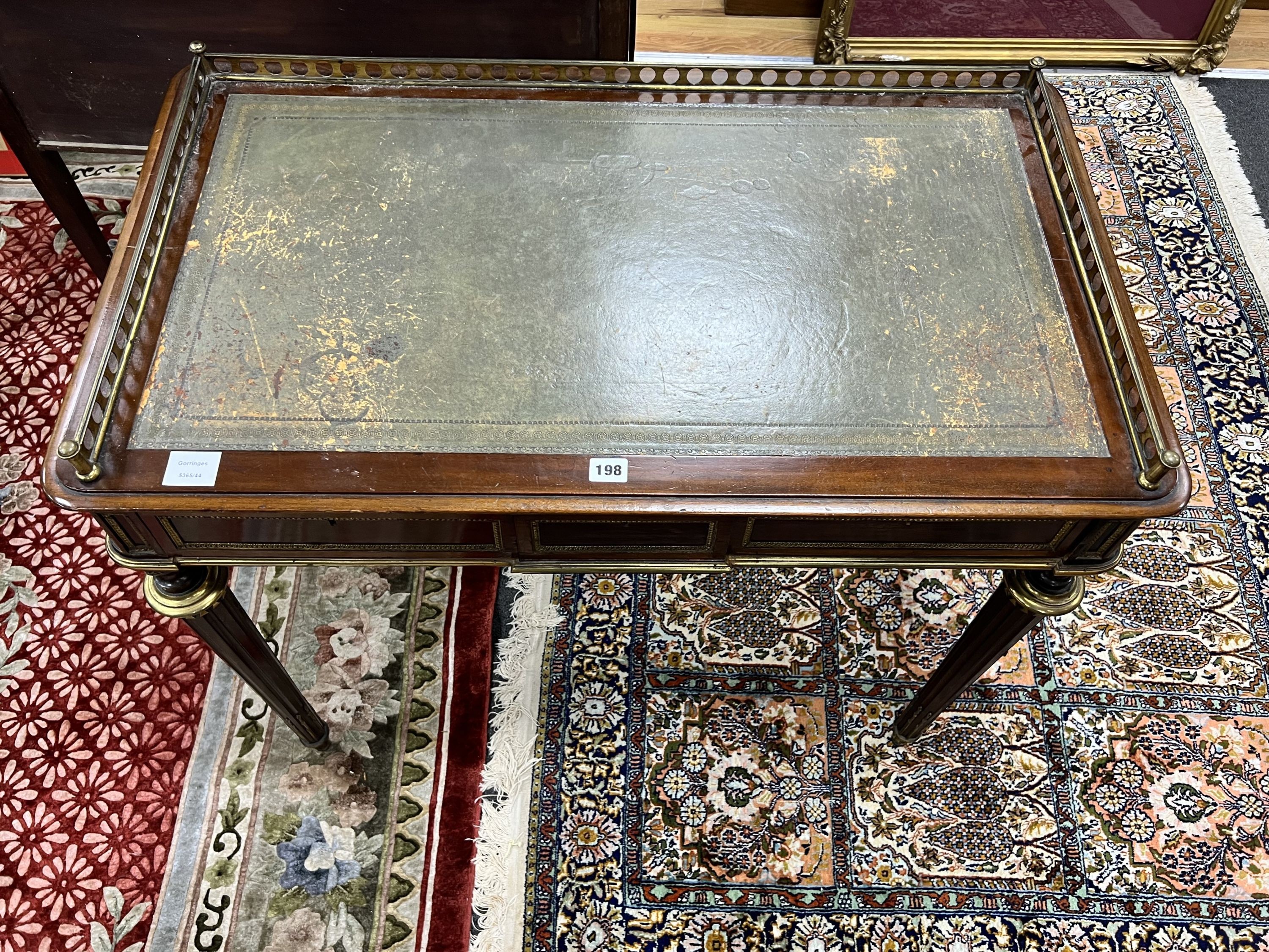 A late 19th century French ormolu mounted mahogany two drawer writing table, width 94cm depth 55cm height 79cm